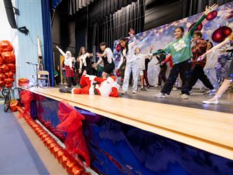 students performing on stage
