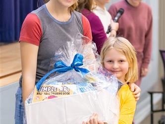 student claiming their prize