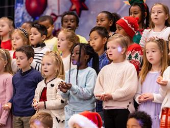 students performing on stage