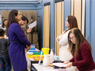 students and guests interacting with activities