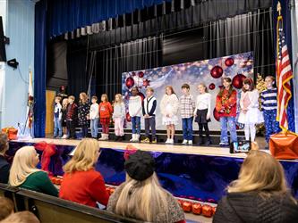 students on stage performing