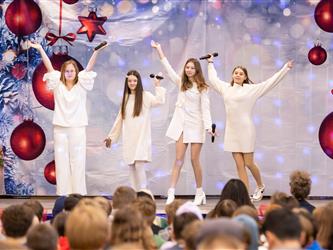 students performing on stage