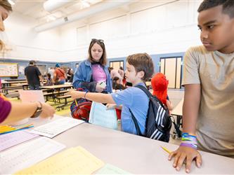 students and guests interacting with activities