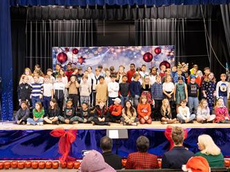 students on stage performing