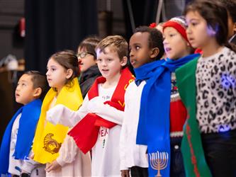 students performing on stage