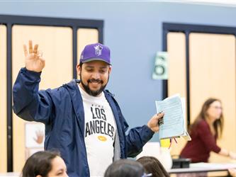 man waving arm 