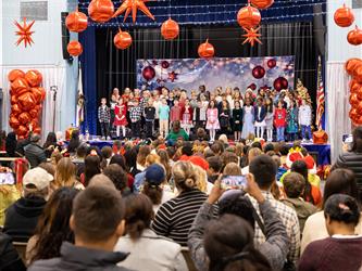 students singing to crowd