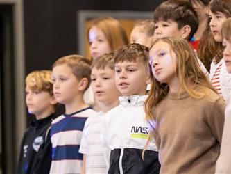 students on stage performing
