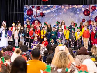students performing on stage