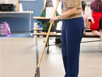 staff sweeping up floor 