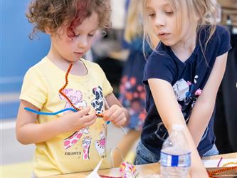 students making craft at table 