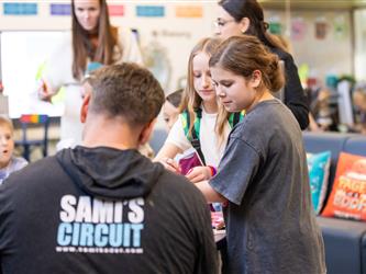 students and guests interacting with activities