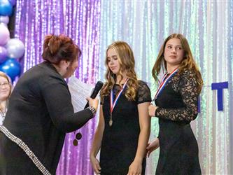 performers walking on stage to receive awards
