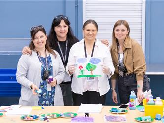 staff posed at table 