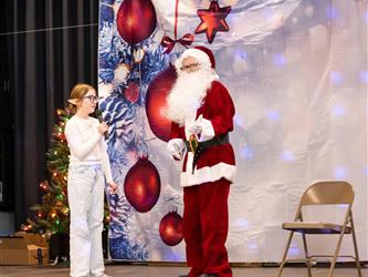 santa performing on stage