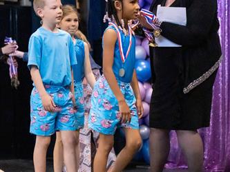 performers walking on stage to receive awards