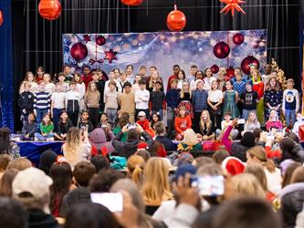 students singing to crowd