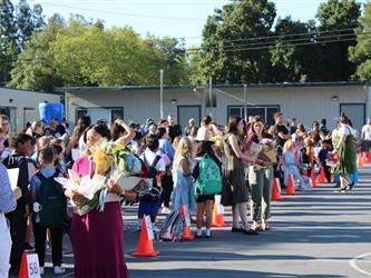 students lined up for school to start